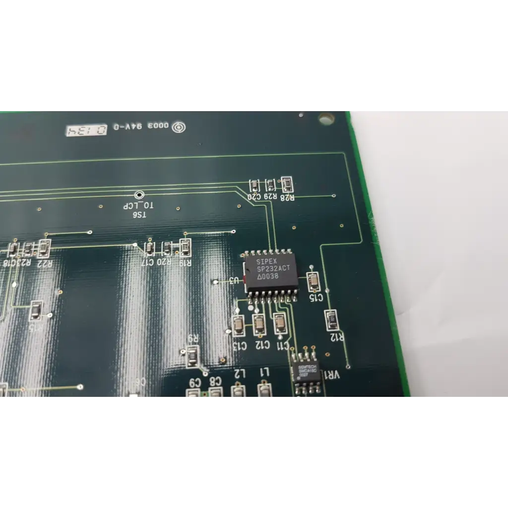Green control interface circuit board pcb 140e51030 rev a with black integrated circuits and silver solder points