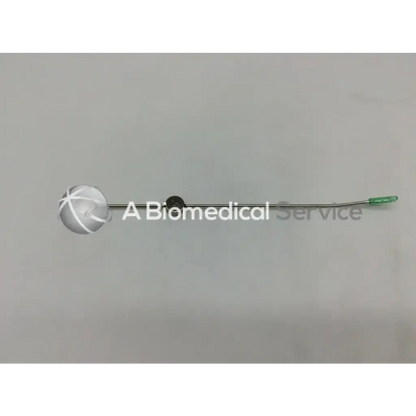 Silver spherical medical instrument with green-tipped handle and metallic shaft cook urological gyn surgical tool