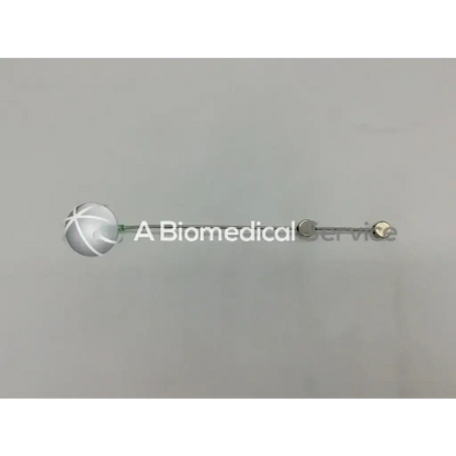 Silver spherical cook urological gyn surgical tool with textured surface and metal rod attachment for ob gyn use