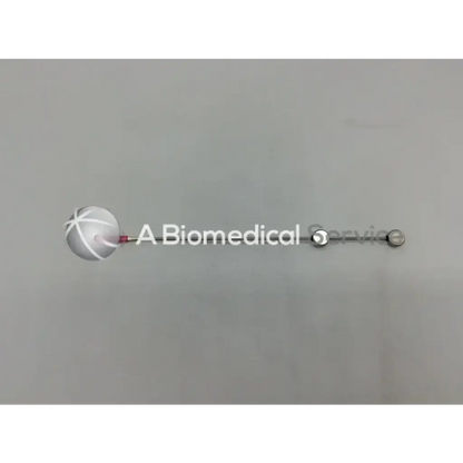 A sleek silver Cook Urological gyn surgical tool with a spherical end cap and central rod for biomedical service