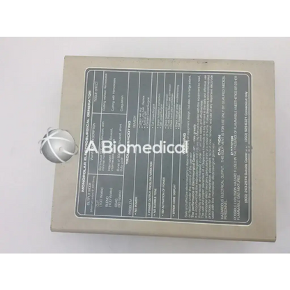 Silver spherical mini-monolar electro-surgical generator with white cord on beige case for coopersurgical leep bbcb5-6