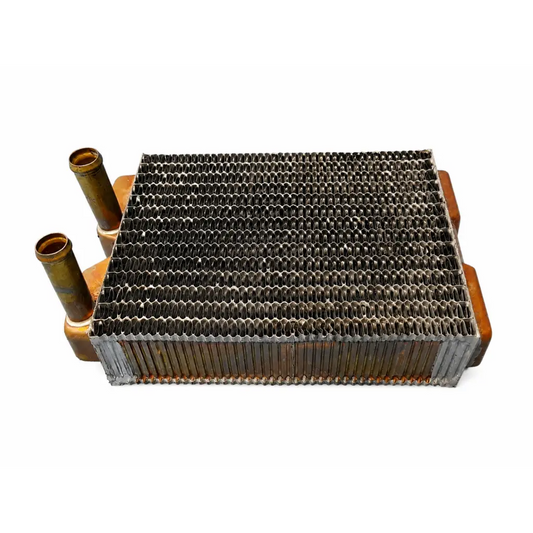 Rusty copper and steel automotive radiator core with honeycomb fins in copper and aluminum heat exchanger coil