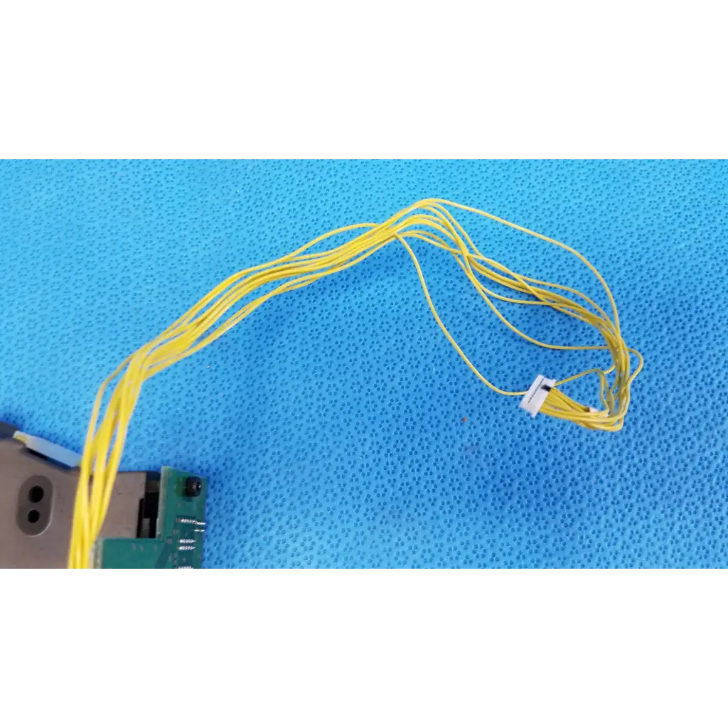 A bundle of yellow flexible cables with white connector for counter-pcb optical sensor housing on topcon retinal camera