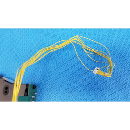 A bundle of yellow flexible cables with white connector for counter-pcb optical sensor housing on topcon retinal camera