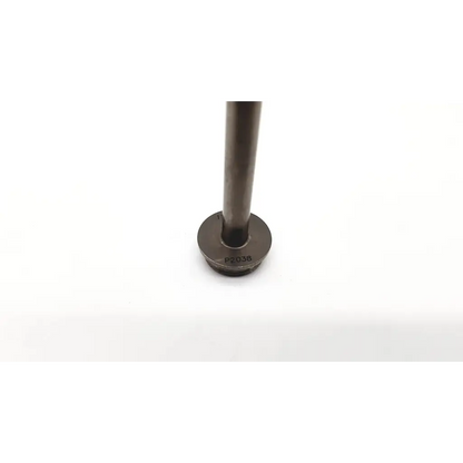 Dark gray metallic cylindrical versaport metal cannula with flat circular base marked pt038 for covidien 177792