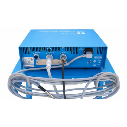 Back of blue covidien force fx-c electrosurgical generator with multiple ports and coiled gray cables on mobile cart