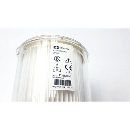Clear plastic container holding white pleated covidien puritan bennett x800 expiratory filter for respiratory use