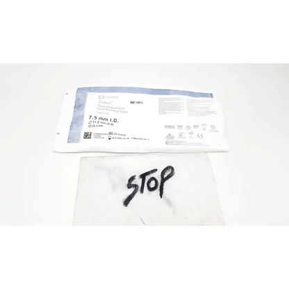 White sterile surgical drape with black stop text on covidien shiley evac trachtubes with taperguard cuff 7.0 mm