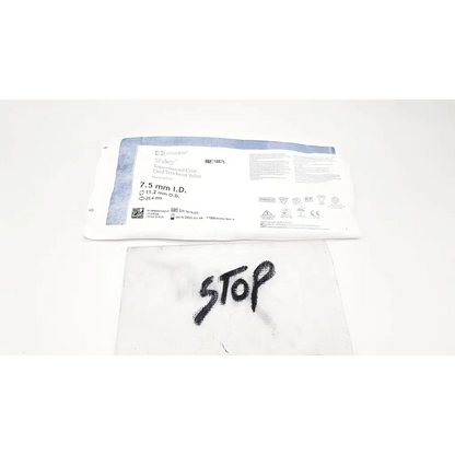 White sterile surgical drape with black stop on covidien shiley evac trachtubes taperguard cuff 7.0 mm product