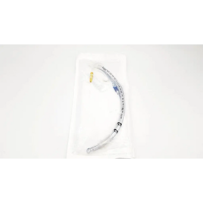 Clear plastic covidien shiley evac endotracheal tube with gold connector and blue markings in sterile white wrapping
