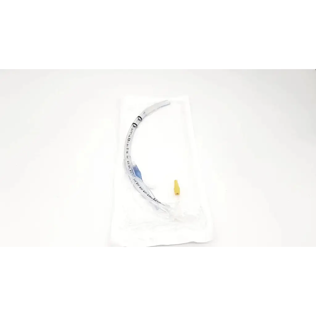 Transparent curved covidien shiley evac trachtubes airway tube with yellow tip blue markings 7.0 mm taperguard cuff