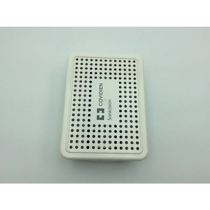 White rectangular covidien surgical sonicision reusable case with circular perforations for surgical tool storage