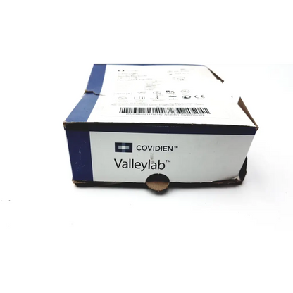 A white and blue cardboard box featuring covidien valleylab logos for covidien valleylab needle electrode e1552 7.2 cm
