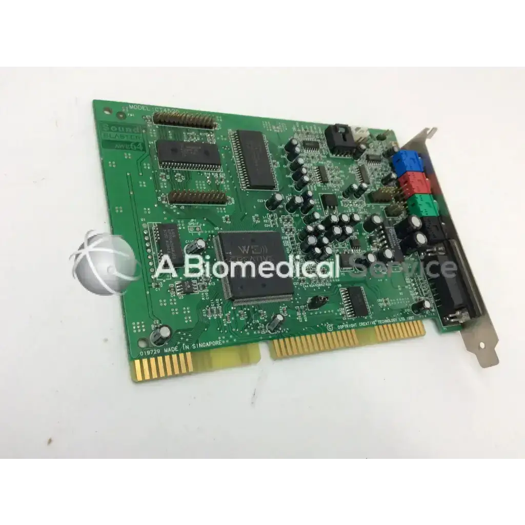 Green printed circuit board with black integrated circuits colorful connectors and gold-plated edge of creative labs sound blaster awe64 ct4520 isa sound card