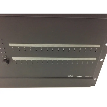 Black rack-mountable crestron dm-md16x18 hdmi audio interface with numbered jacks for high definition digital media distribution
