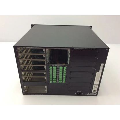 Black Crestron dm-mdx8x8 server rack back with multiple expansion slots and green ports for high definition digital media distribution