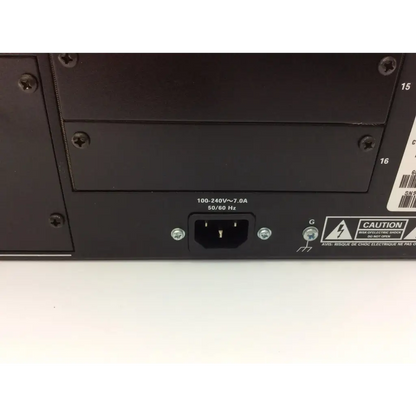 Black power supply unit with standard plug and safety labels on the back of crestron dm-mdx8x8 high definition digital media distribution