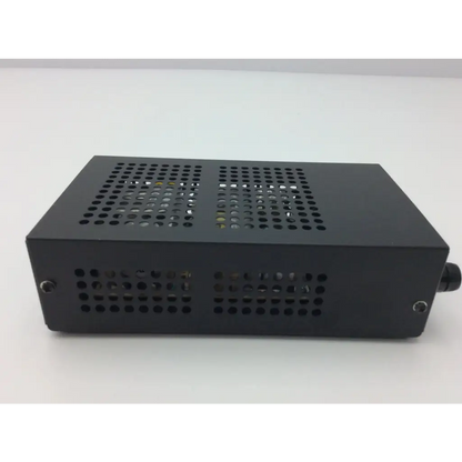 Black rectangular crestron cnpws-75 power supply with perforated metal casing and rounded corners for reliable power delivery