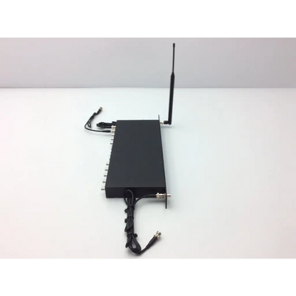 Black rectangular crestron cp2e professional media system control processor with antenna and silver connectors on back side