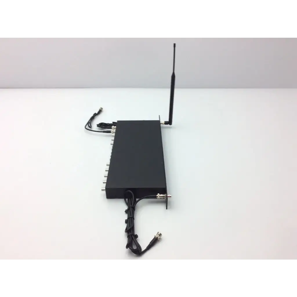Black rectangular crestron cp2e professional media system control processor back with antenna and silver connectors