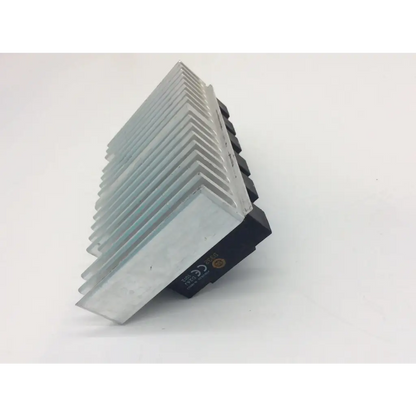 Silver aluminum heat sink with black plastic mounting base on crydom d1202 solid state relay for efficient cooling