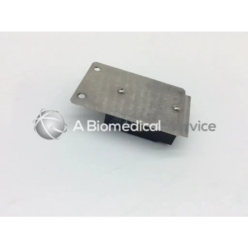 Silver metal plate secured by three screws on the back of a black crydom d2425 relay 25a 240vac component
