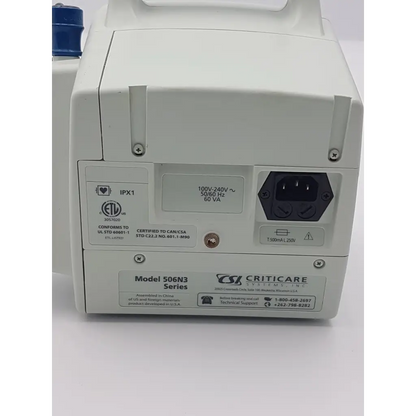 White plastic csi criticare 506n3 medical device with blue cap labeled model 506n3 series comfort cuff patient monitor