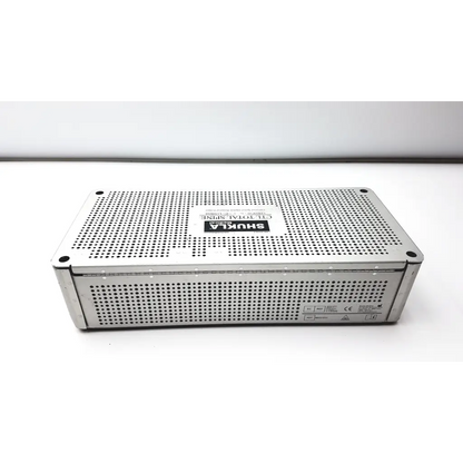 Silver perforated metal surgical instrument box with shukla branding and ctl total spin ref mks1031 model labeling