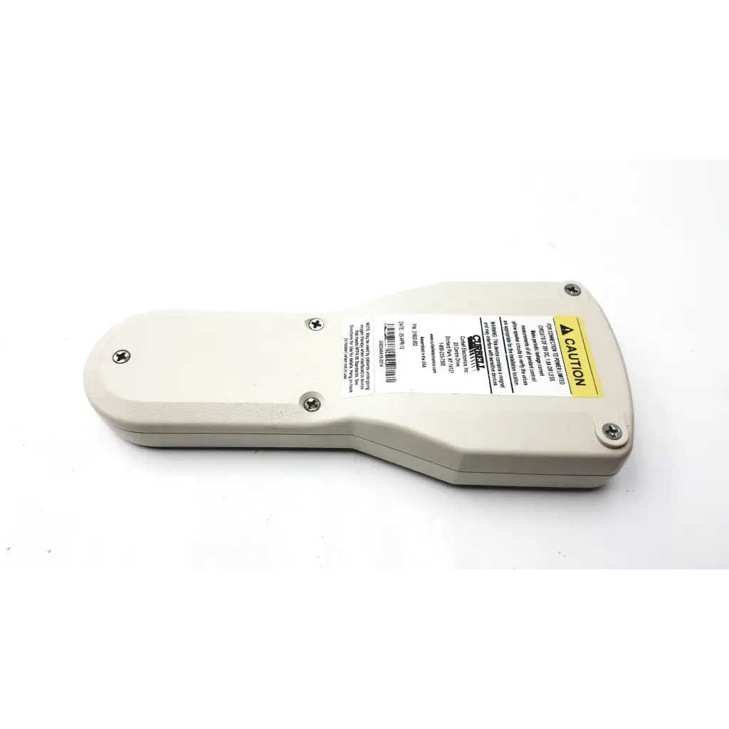 Beige plastic curbell 31802-002 hospital pillow speaker with yellow caution label and barcode sticker on the back side