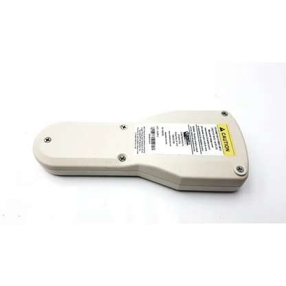 Beige plastic curbell 31802-002 hospital pillow speaker with yellow caution label and barcode sticker on the back side