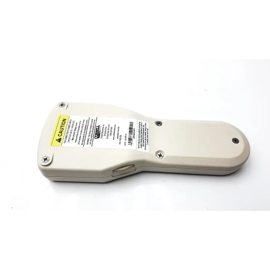 Beige plastic curbelle 31802-002 hospital pillow speaker with yellow caution and white info stickers visible