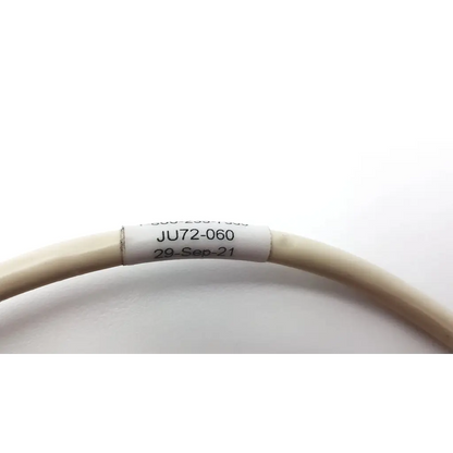 Beige coiled curbell ju72-060 communication jumper cable with white label dated 29-sep-21 for video and communication use