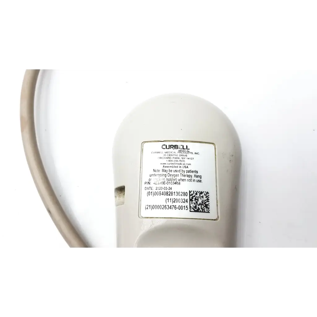 Off-white plastic curbell speaker nurse call remote showing label as a curbell medical product