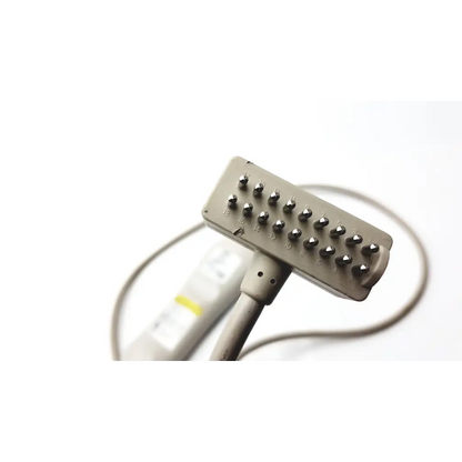 Gray rectangular curbell speaker nurse call remote with metallic numbered protrusions for targeted muscle stimulation