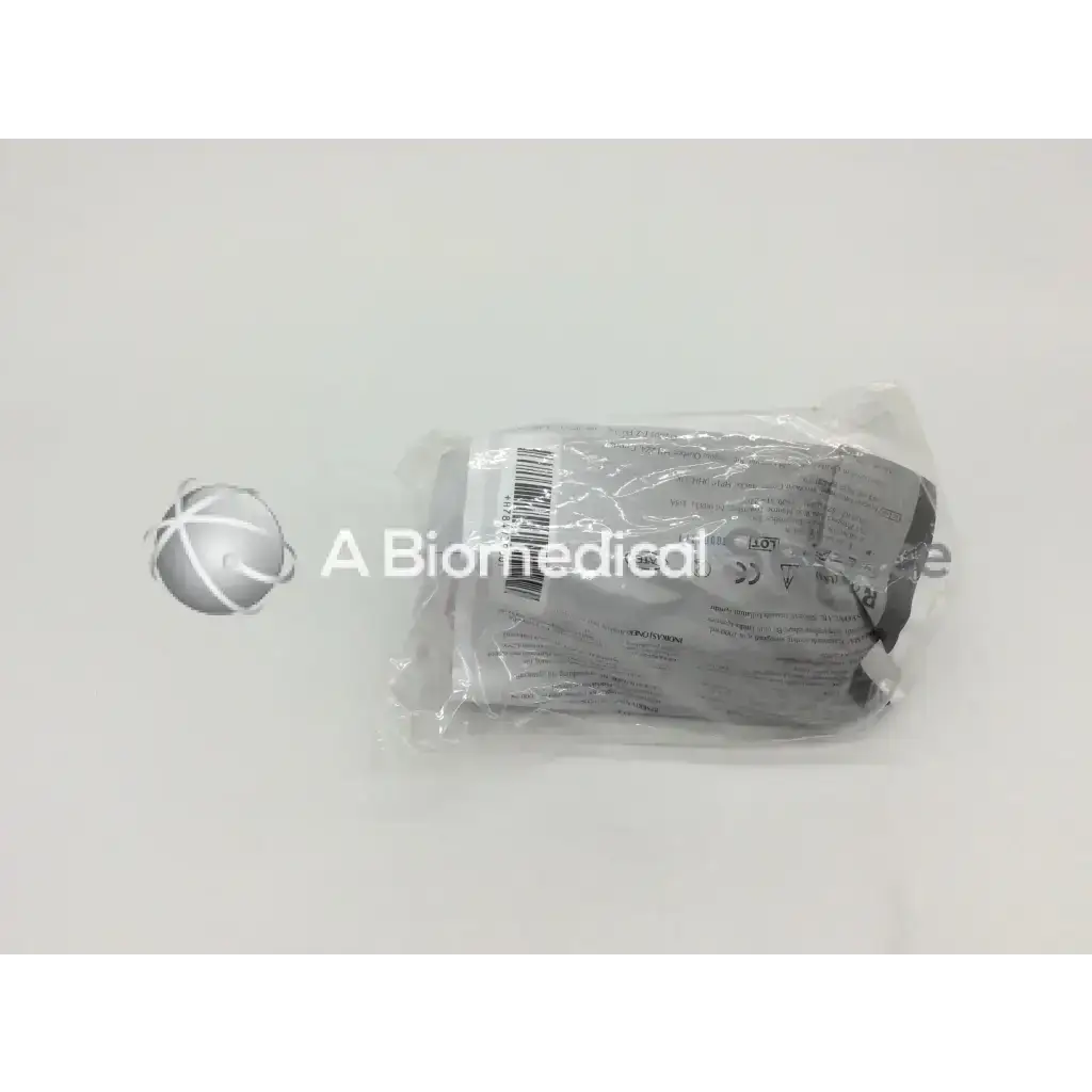 A gray sterile cysto-aid urine collection device v390 packaged in clear plastic with barcode and regulatory labels