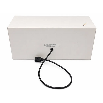 Black power cable with rectangular connector attached to the back of a white biomed certified daavlin m series phototherapy unit