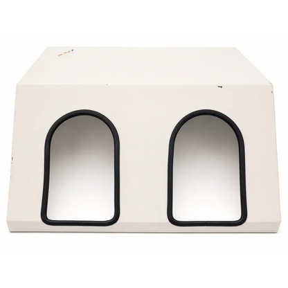 White rectangular pet house with two arched black-trimmed entrances for biomed certified daavlin m series phototherapy unit