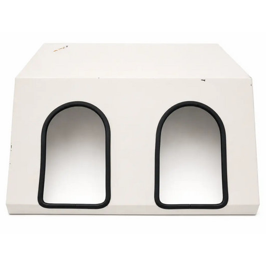 White rectangular pet house with two arched black-trimmed entrances for daavlin m series phototherapy unit