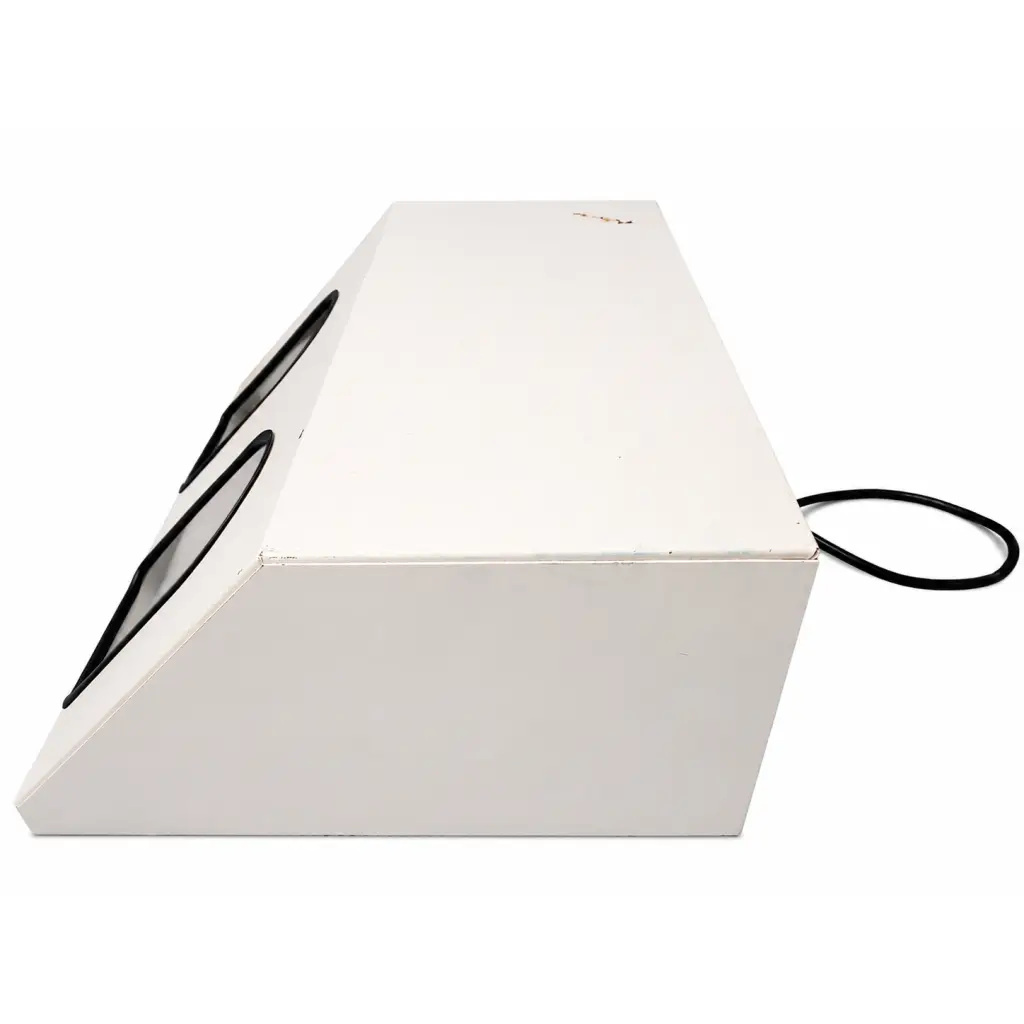 White rectangular daavlin m series biomed certified phototherapy unit with black oval cutouts and a black cord