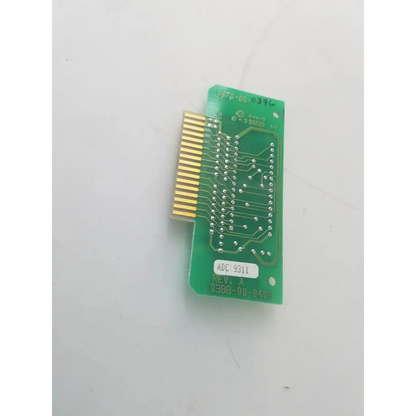 Green printed circuit board with gold pin connector and adc 9311 label on datascope 0387-00-0403 controller bbcb3-10b