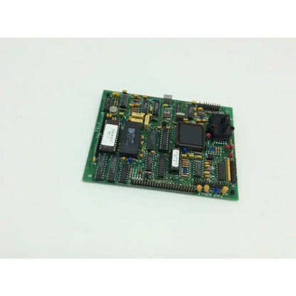 Green printed circuit board of datascope 0670-00-0375 controller with black integrated circuits and yellow capacitors