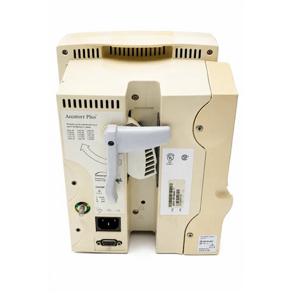 Beige datascope accutorr plus biomed certified vital signs monitor with white handle and ventilation grilles