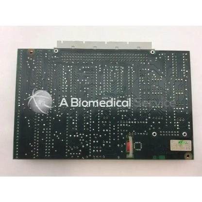 Black rectangular pcb circuit board with silver solder points and biomedical service logo for Datex AC 4F device