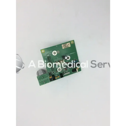 Green rectangular circuit board with electronic components and gray cylindrical attachment for datex as3 compact rec-buffer board