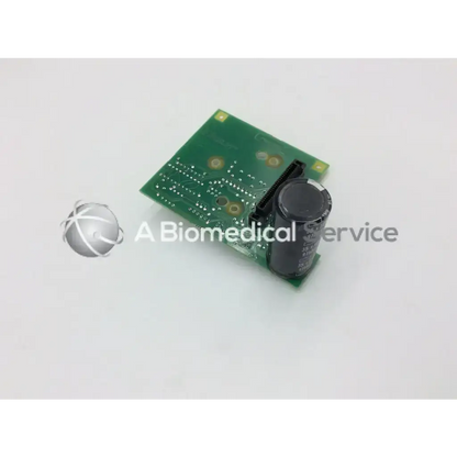 Green rectangular datex as3 compact rec-buffer board with a black cylindrical capacitor for electronic use
