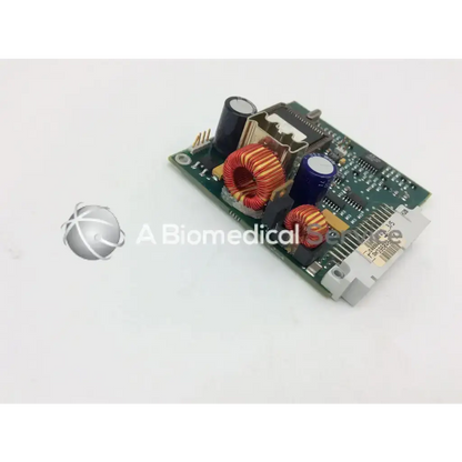Green circuit board with black and blue capacitors red-yellow inductors and white connector datex engstrom 94v-0 board