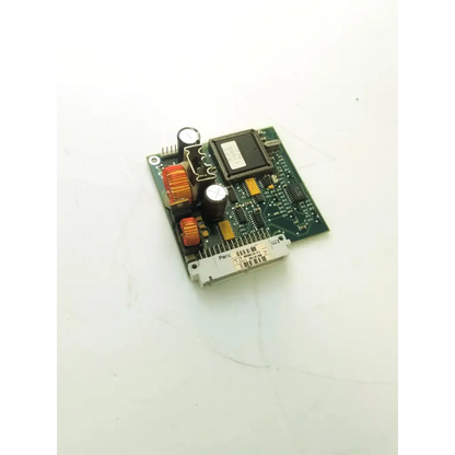 Green printed circuit board of datex-engstrom MI 4F 882430-7 with black ICs, orange capacitors, and white connector bottom side