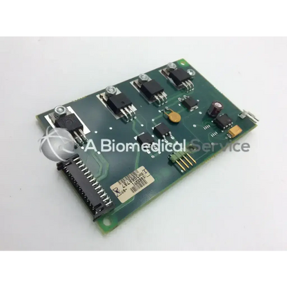 Green rectangular datex engstrom circuit board with black and gold electronic components mounted on it