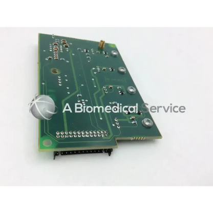 Green rectangular circuit board with silver screws and metallic components for datex engstrom mi 4f 882847-7 model