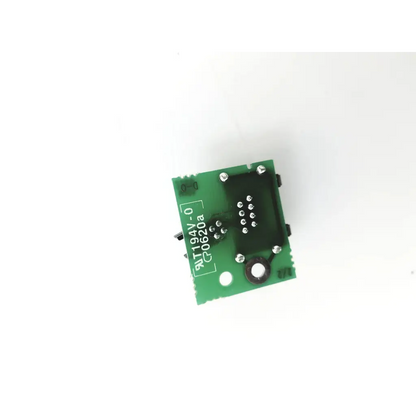 Green rectangular datex fm network connector board unit dm1011329-01 with black integrated circuits and silver solder points
